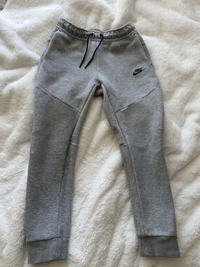Gray Nike tech pants